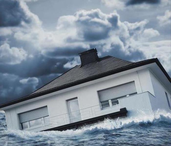 a house floating in a large body of water